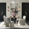 Dining table with black marble top and stainless steel base